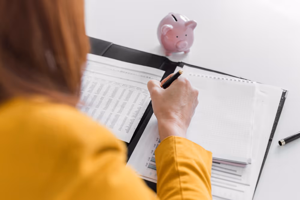 woman writing - Payroll for International Employees
