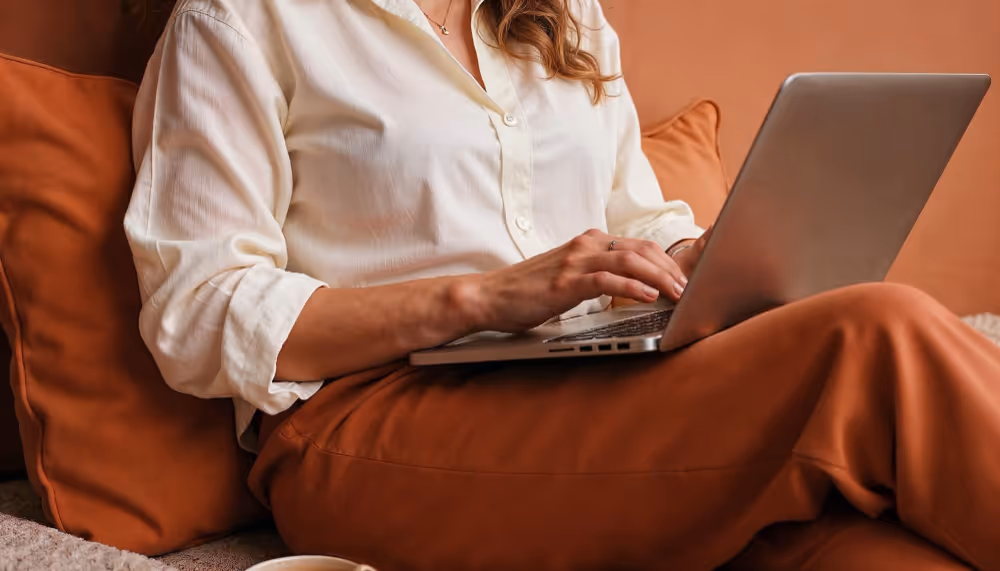 woman on a laptop - How to Pay Remote Employees