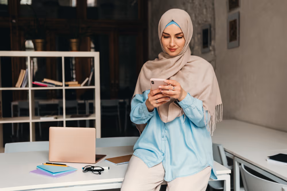woman using a phone - New Rules in Saudi Arabia for Final Exit