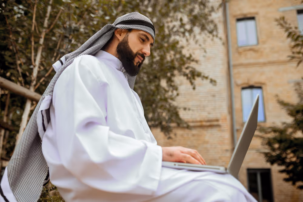 man using a laptop - Saudi Labor Law End of Service