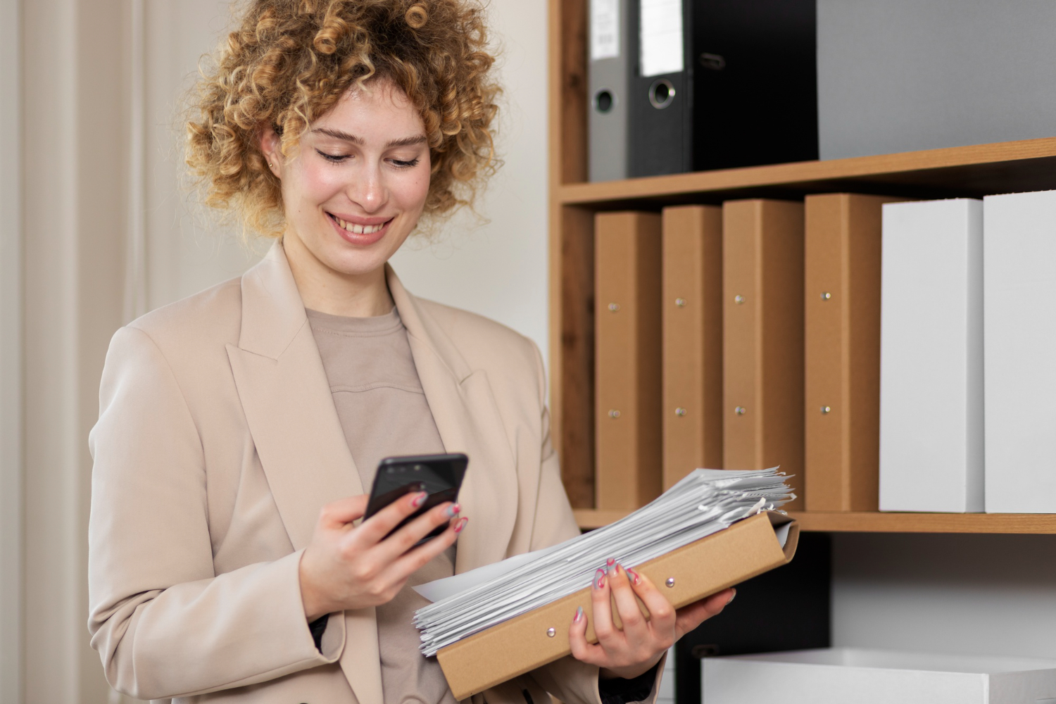 woman using a phone - Best Employer of Record Companies