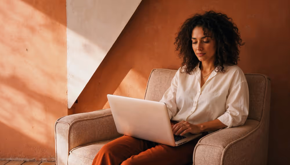 woman using a laptop - Payroll Outsourcing Costs