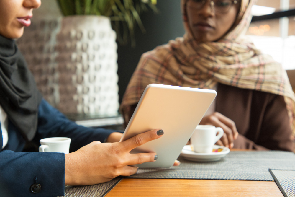 women using a tablet - What is Taqyeem Inspection