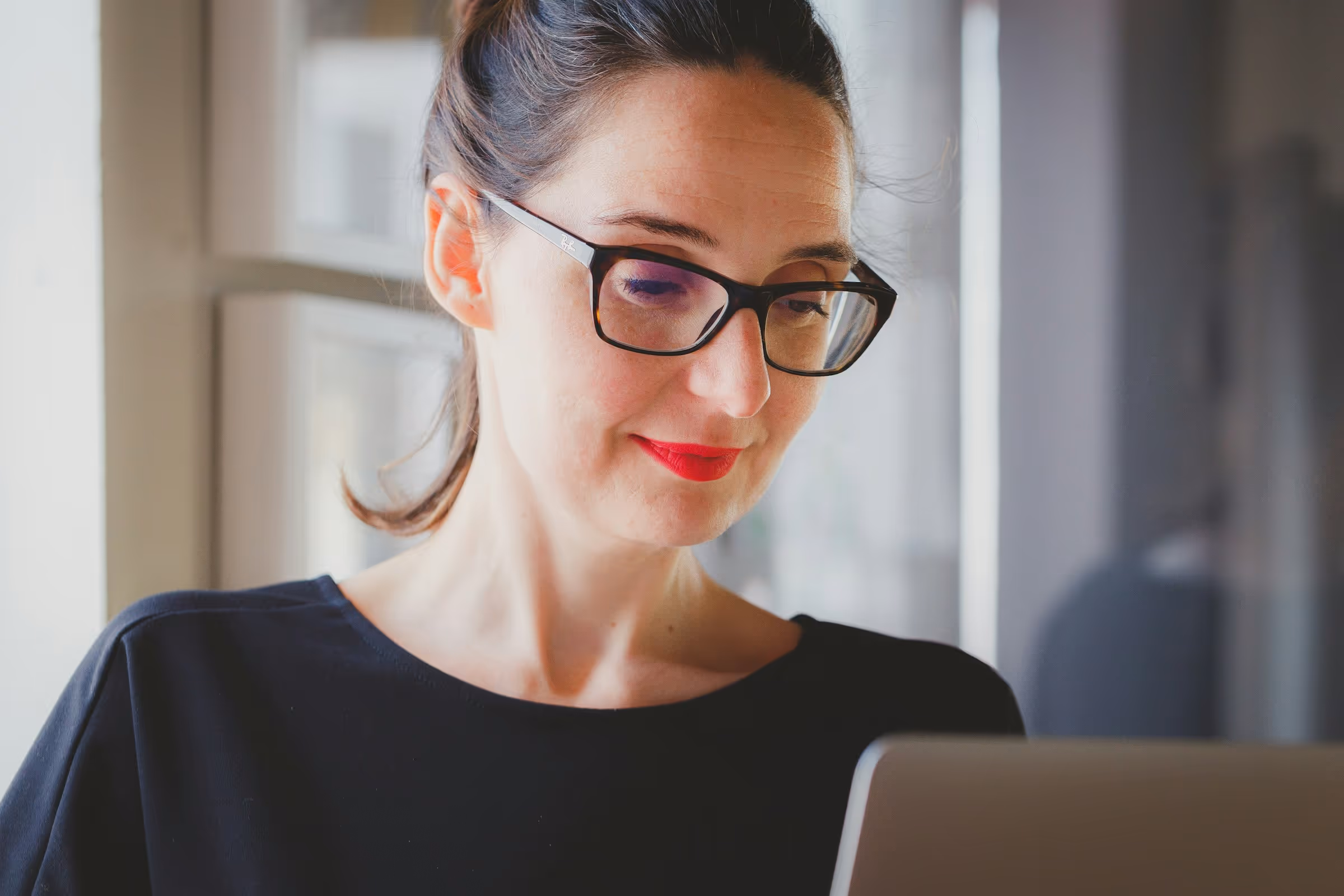 Woman Using Laptop - UAE VAT Registration Threshold