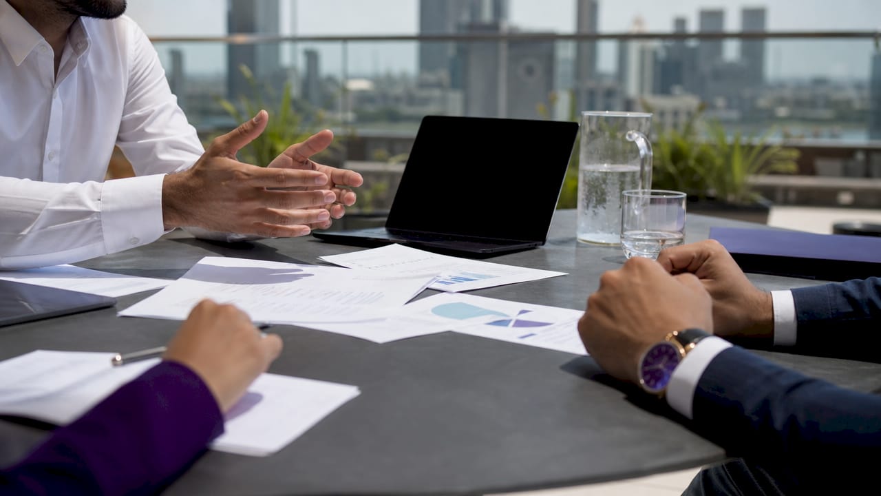 Hands exchanging oil project contracts