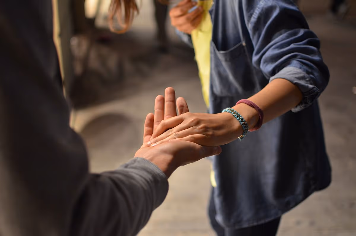 Handshake close up; collaborate with employees concept|Two women looking at tablet screen|Aerial view of three women pointing at laptop screen