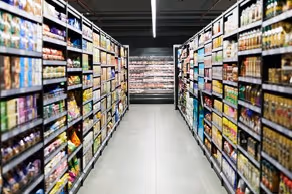 Non-perishable foods stacked in a grocery aisle|View of grocery story aisles from different angles in three separate boxes