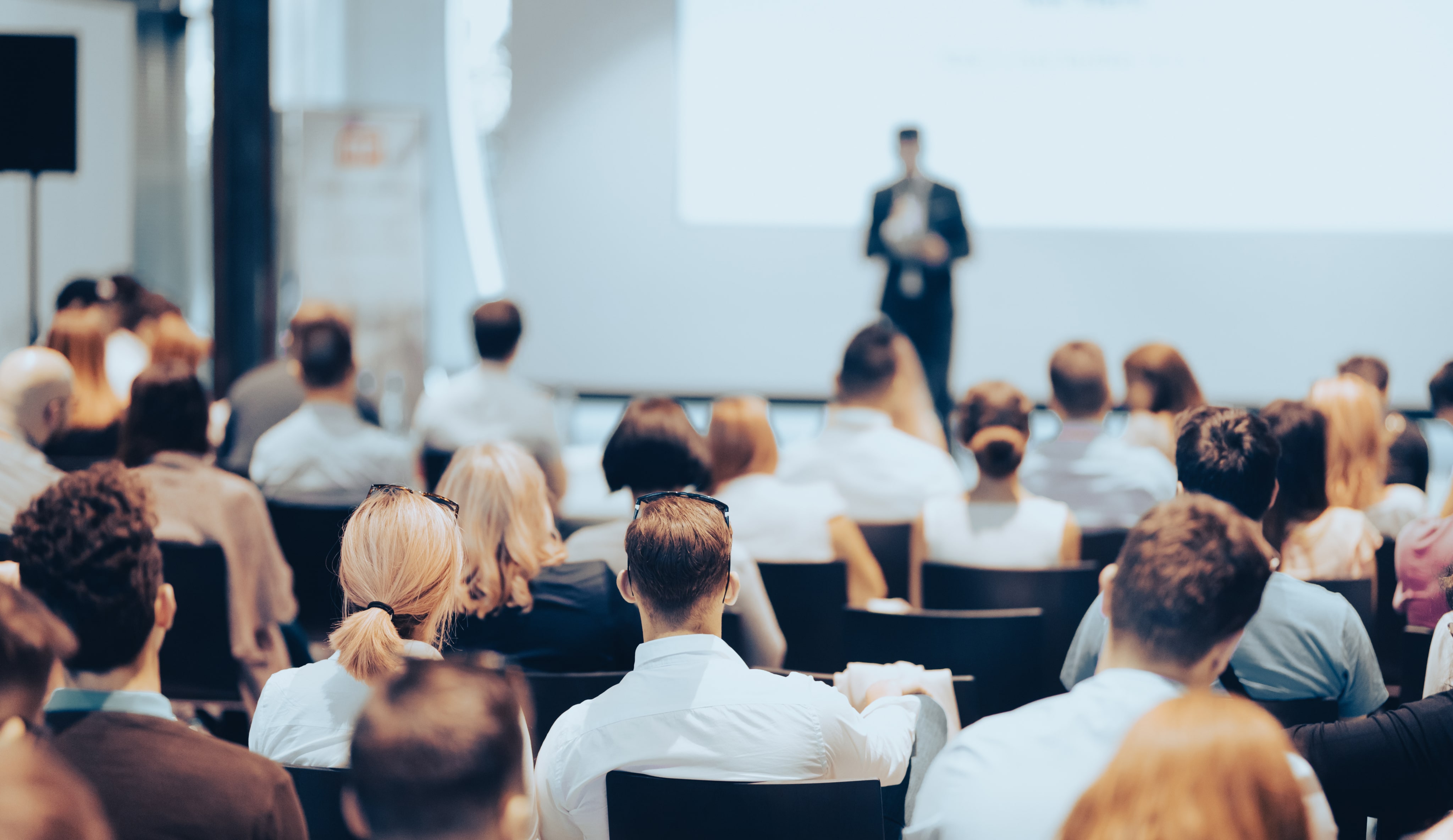 A man giving a presentation to a group of people.