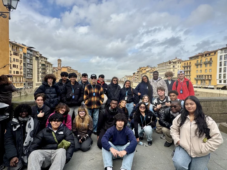 Students posing on a Florence bridge during international school trip