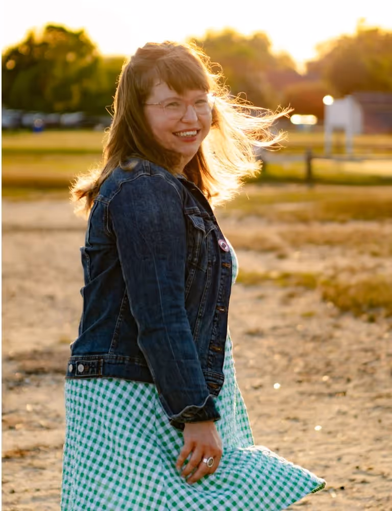 Abigail Myers smiling outdoors at golden hour