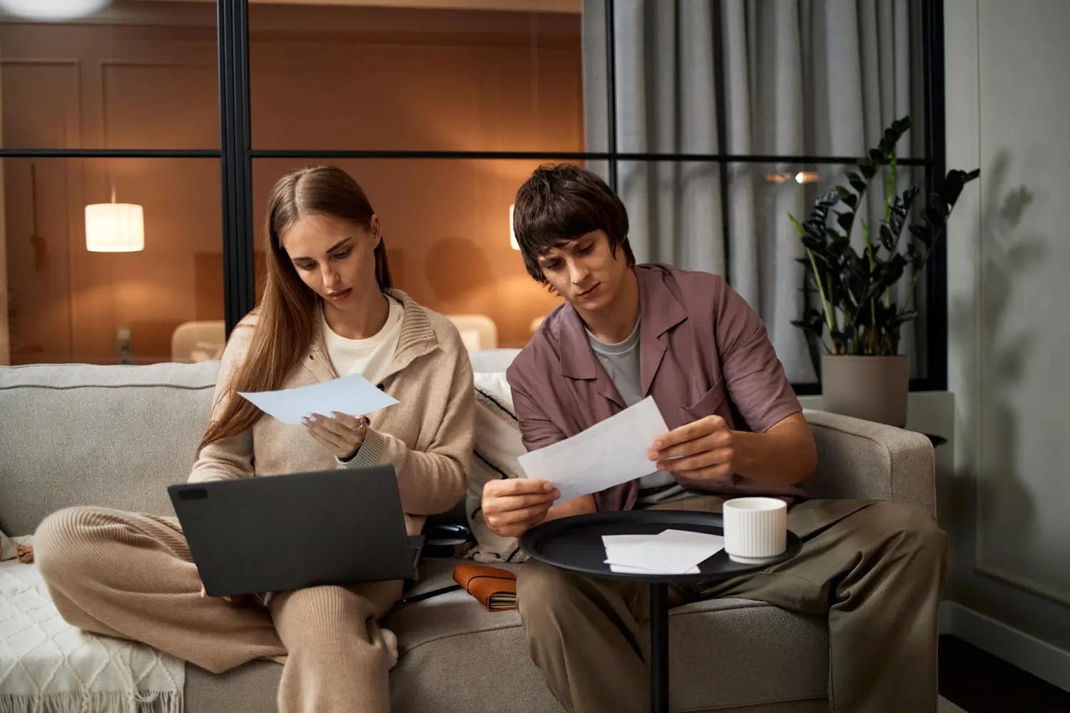 young woman and young man reviewing documents together