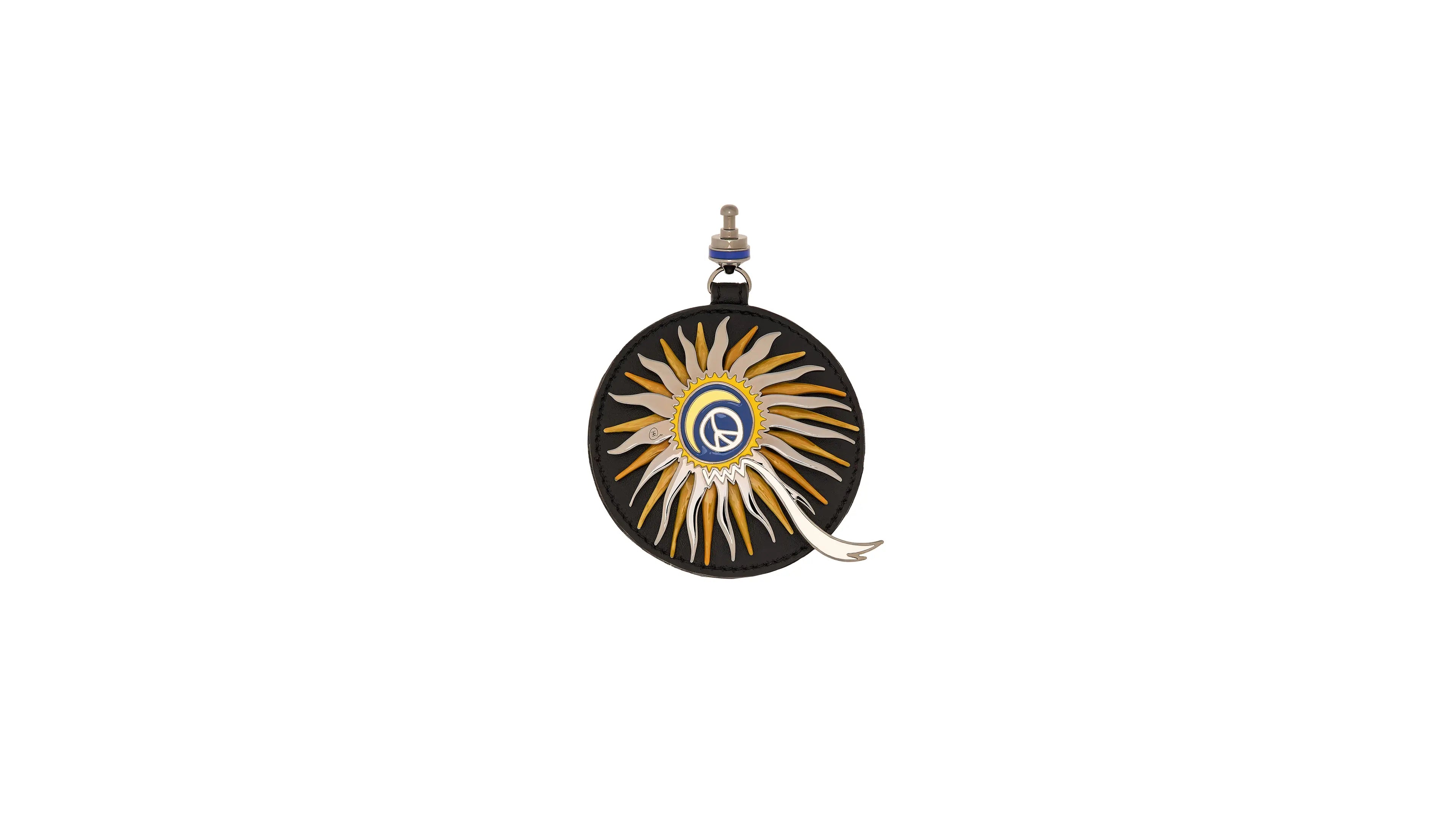 Decorative reel with sunburst design on a white background