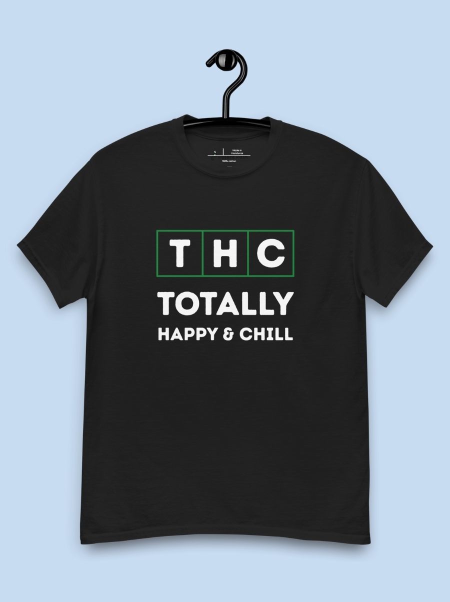 Black shirt on a hanging and blue background with the text "THC" in blocks with a green outline and the text "Totally Happy and Chill" underneath