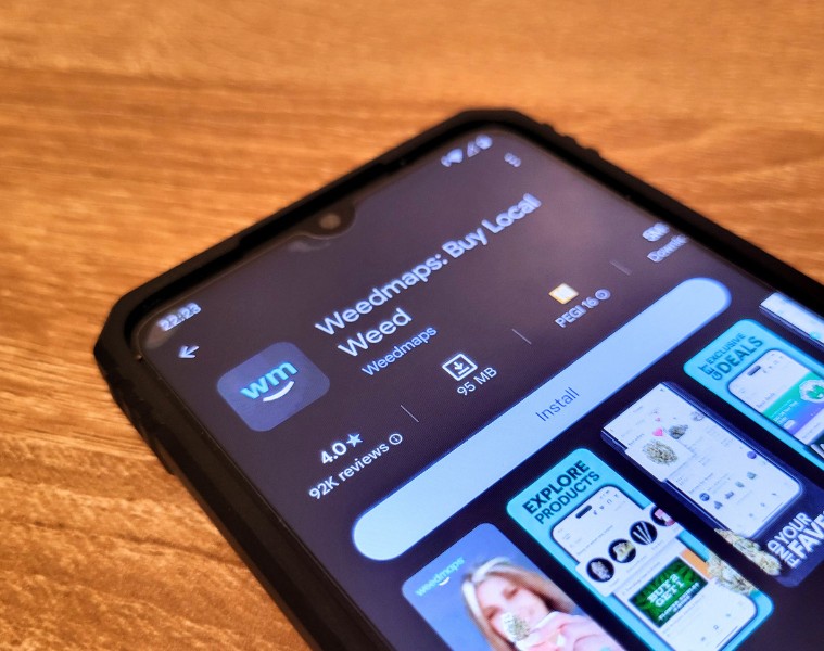 Smartphone displaying the Weedmaps app download page in the Google Play Store