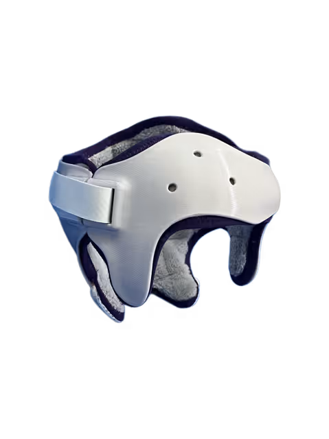 Casque de protection orthopédique avec coque rigide blanche et rembourrage intérieur gris foncé.