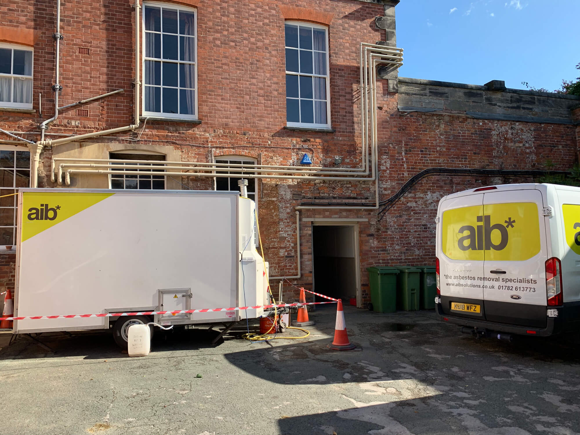 AIB Solutions van and decontamination unit on site