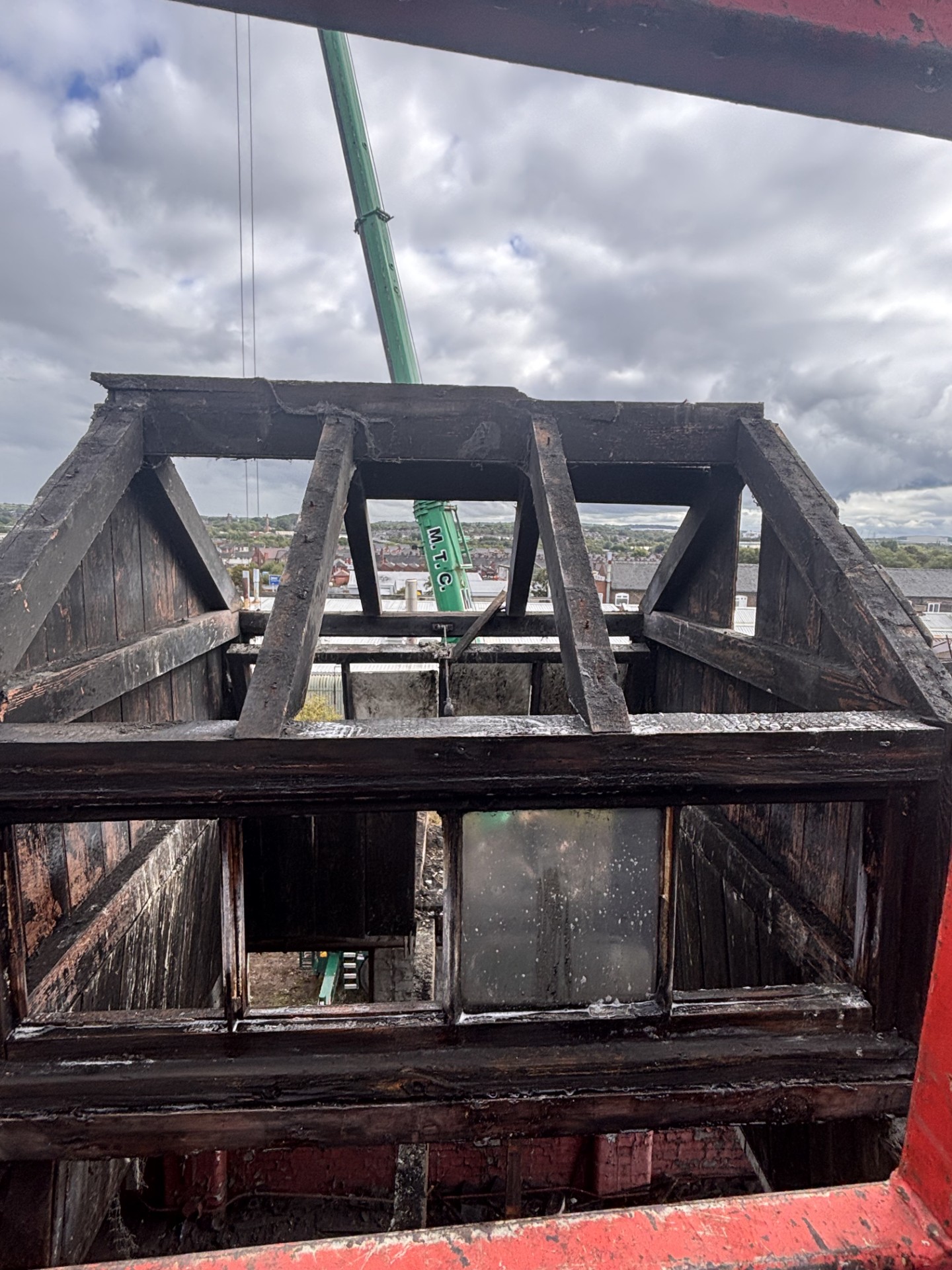 Working at height from the man basket at the fire-damaged high-level structure