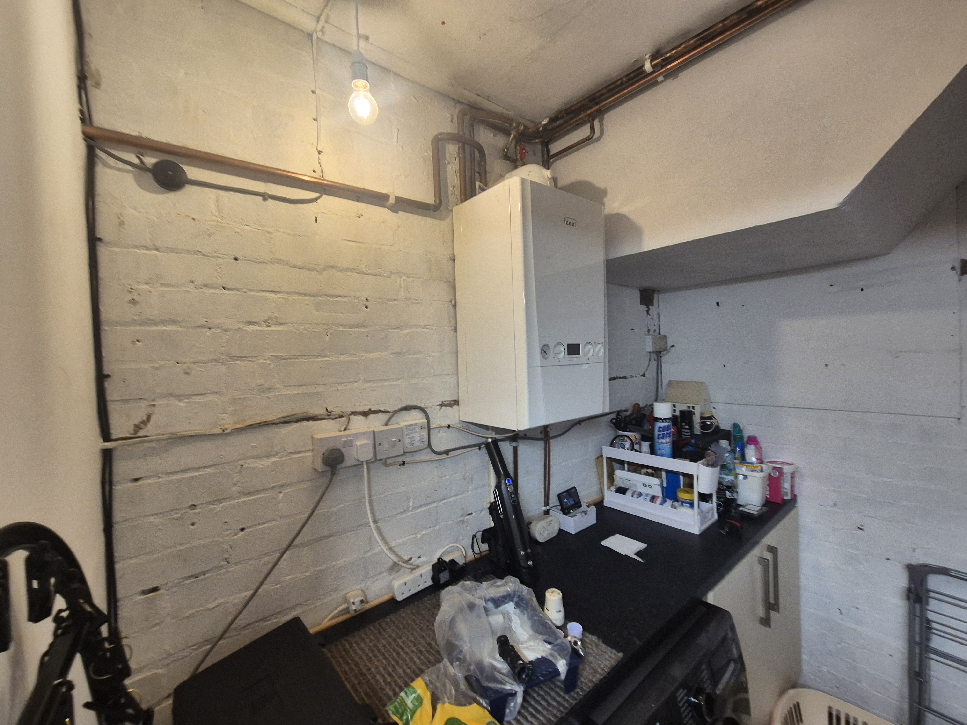 AIB ceiling panels in a domestic utility area before licensed removal