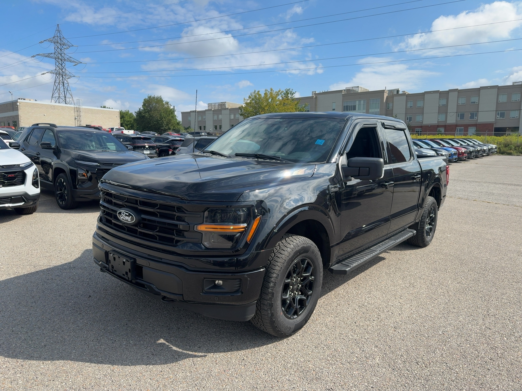 2024 Ford F-150 XLT, black, front three-quarter view