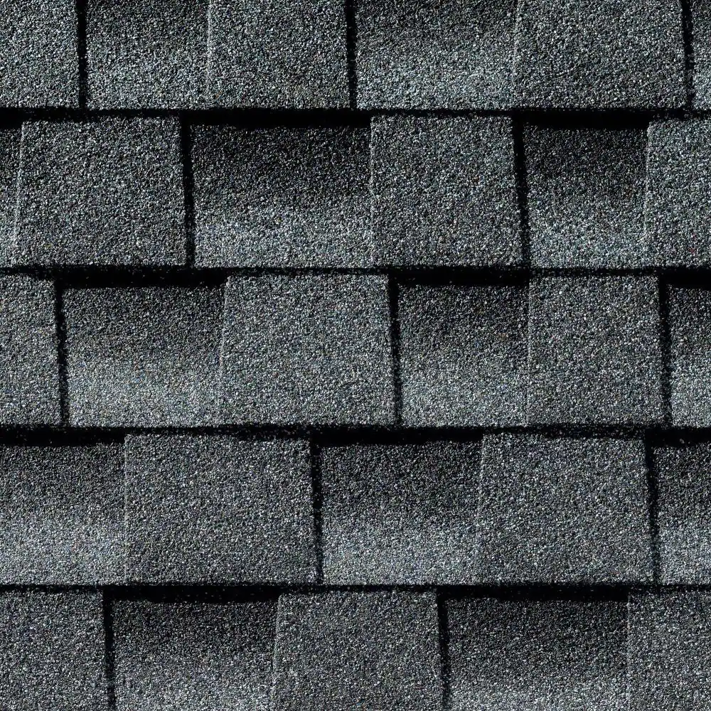 Dark asphalt shingles arranged in a grid pattern on a roof.