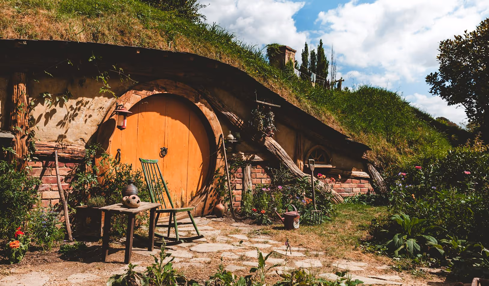Stools and chairs with a circular door covered with grass