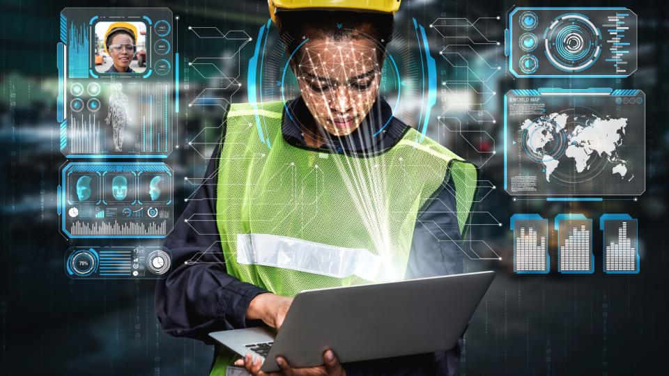 A mobile worker using a laptop with a facial scanner.