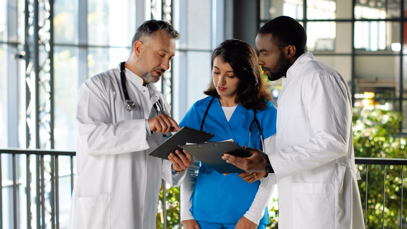 A team of healthcare workers collaborates on a plan, illustrating effective workforce management strategies in action.