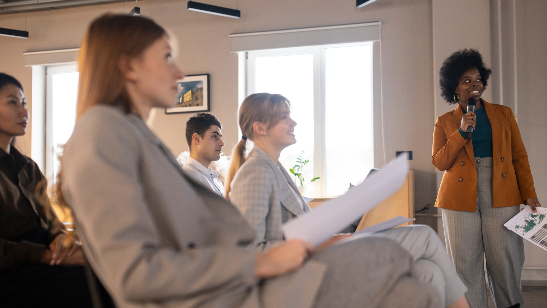 Speaker addressing a seated audience during a workshop on choosing scheduling software.