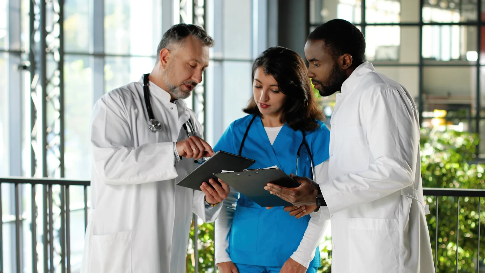 A team of healthcare workers collaborates on a plan, illustrating effective workforce management strategies in action.