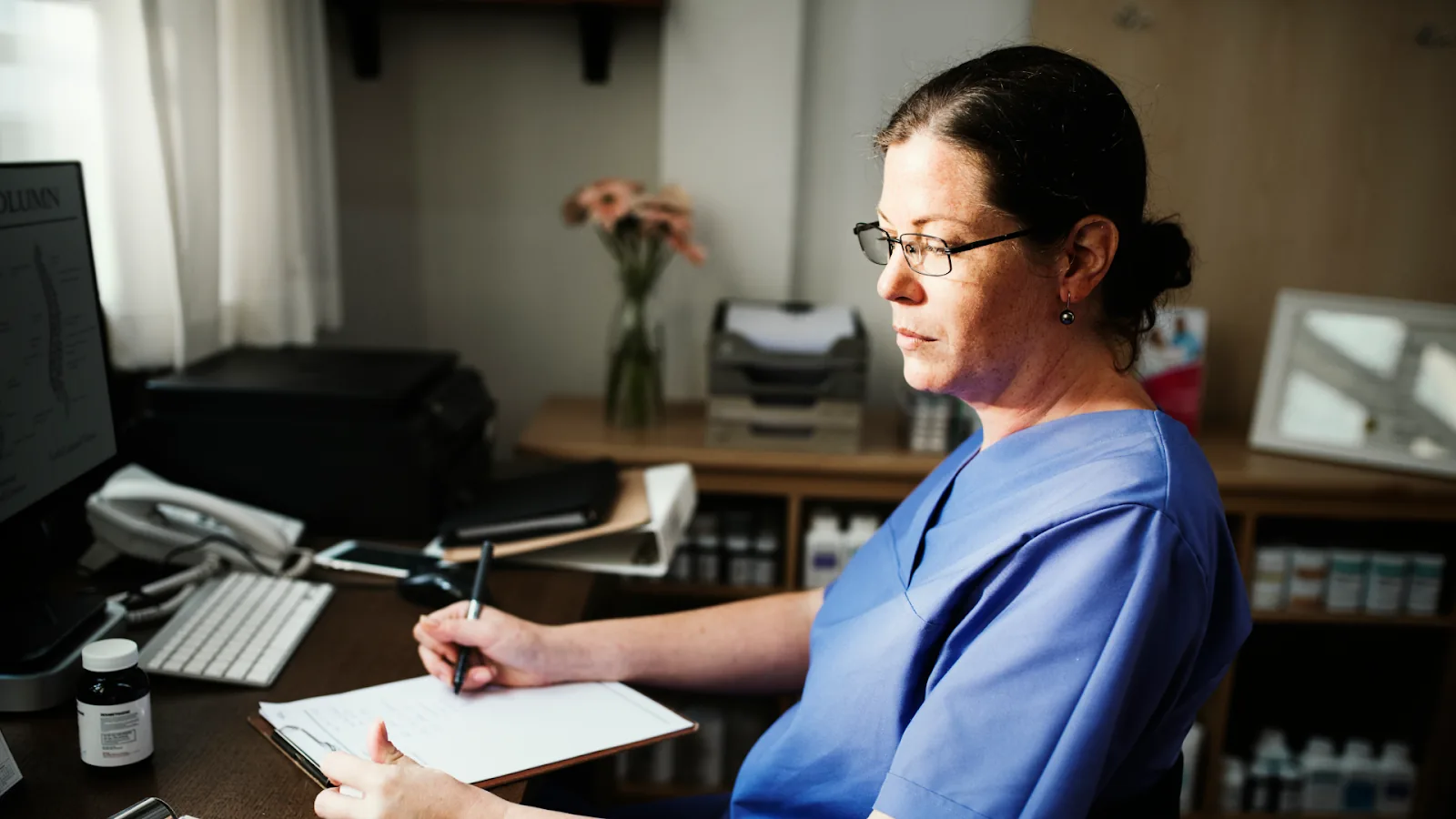  A medical professional calculating headcount using coverage hours and a relief factor for a 24-hour shift schedule.