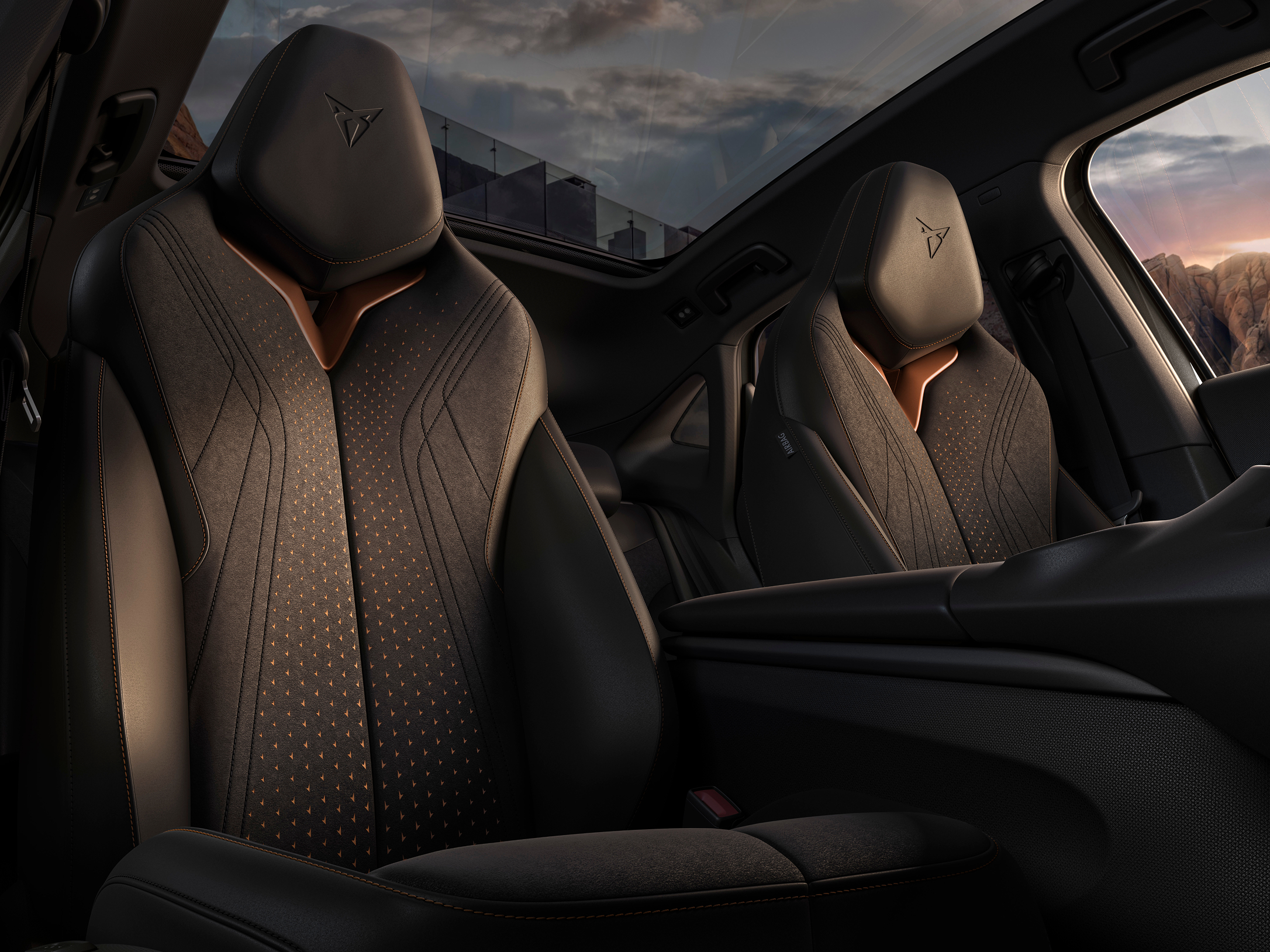 Interior view of car door panel with textured trim, illuminated small arrow patterns, window control button, and side mirror.