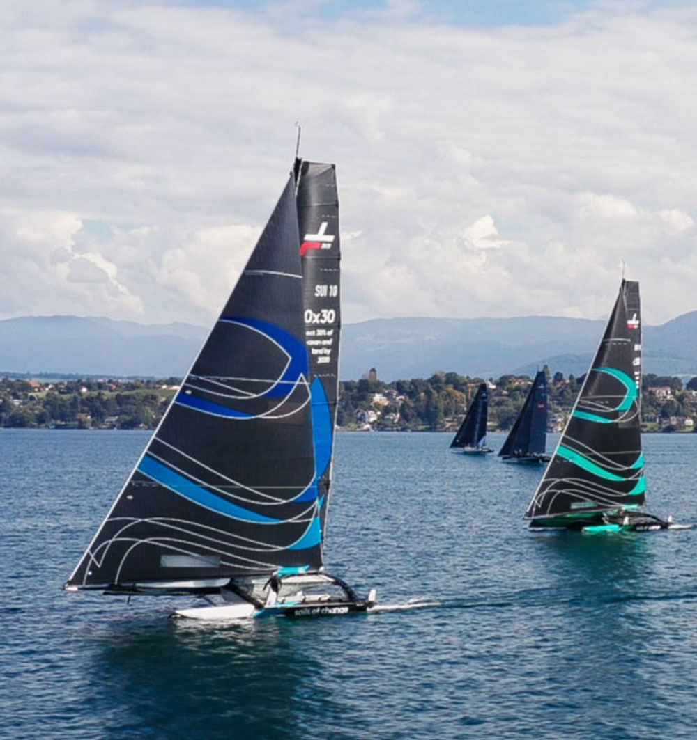 Two Sails of Change boats racing on the water