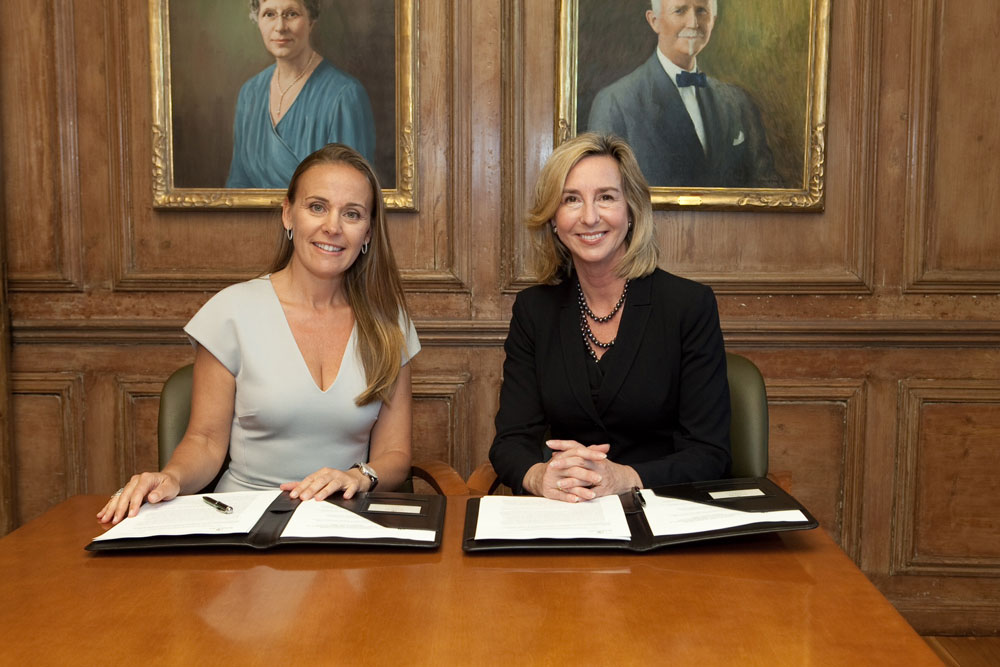 Dona Bertarelli signing a document
