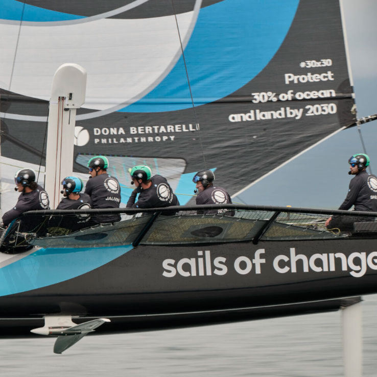 Sails of Change boat on the water