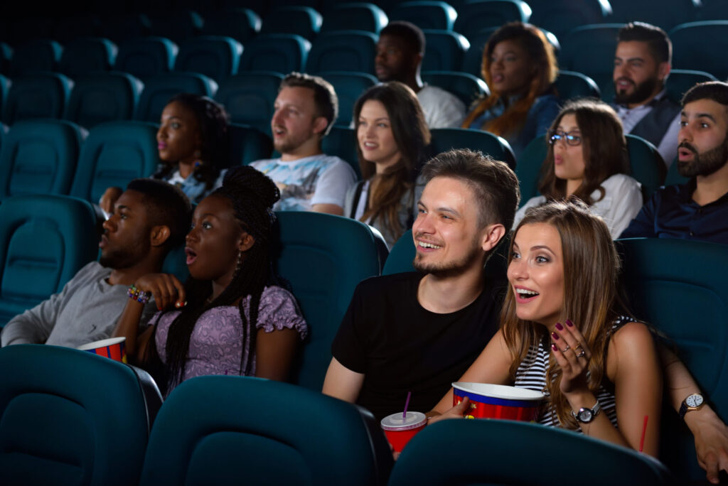 people enjoying a movie in the theatre