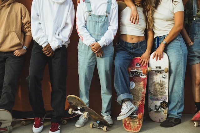 skaters style, wearing baggy jeans, adidas and vans sneakers 