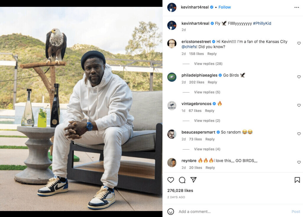 Photo of instagram influencer  Kevin Hart with a Bald Eagle posing