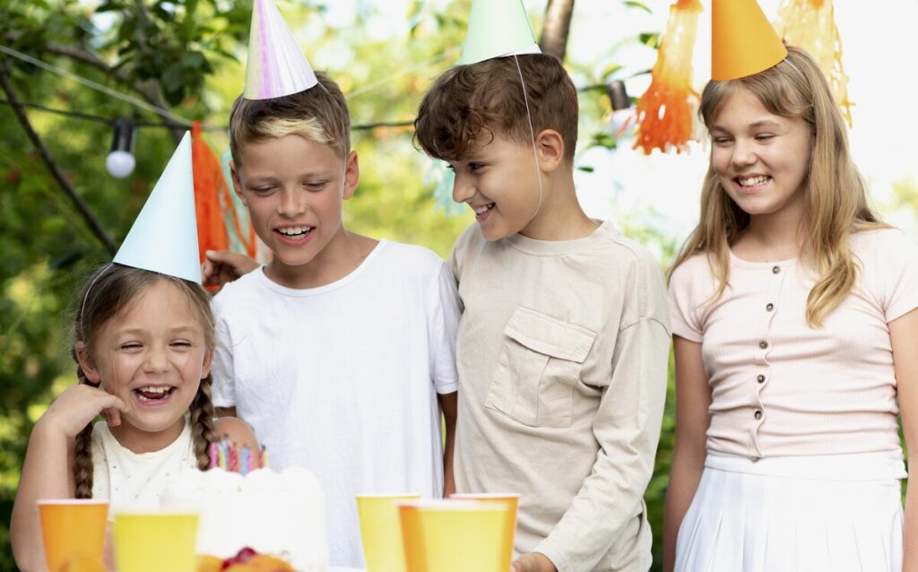 A child celebrating their birthday with friends