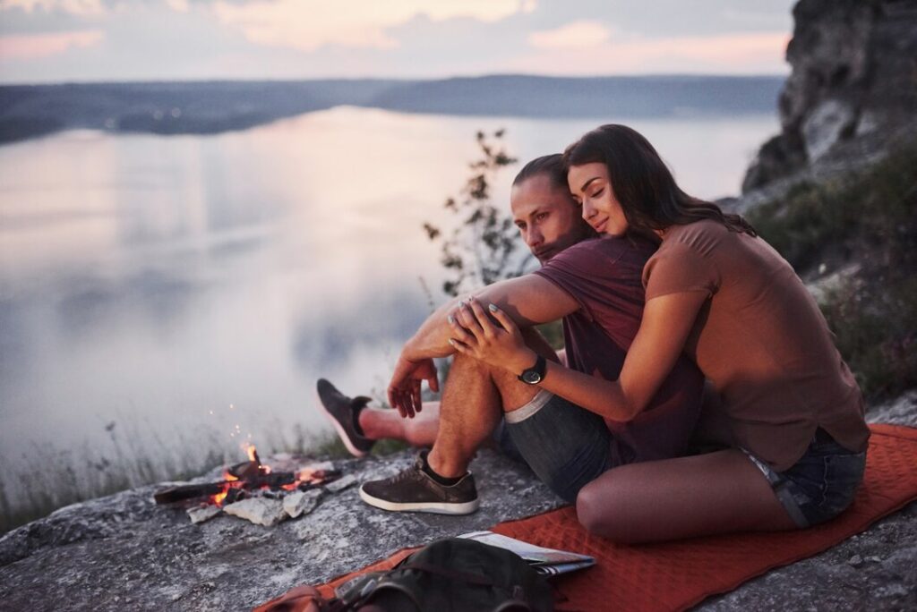 A couple resting after a hike