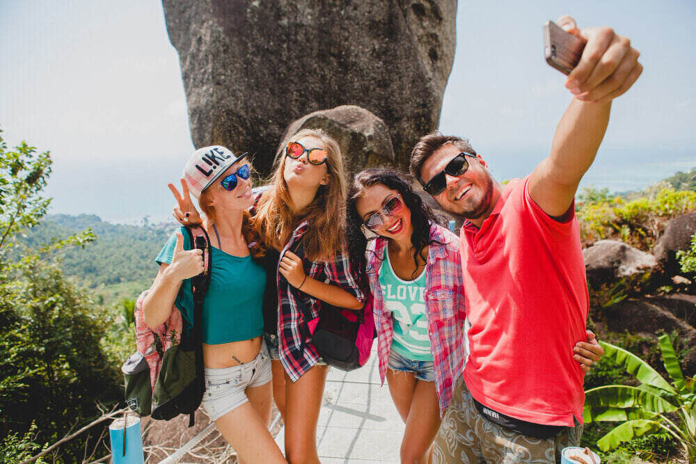 Friends having a trip and posing for picture