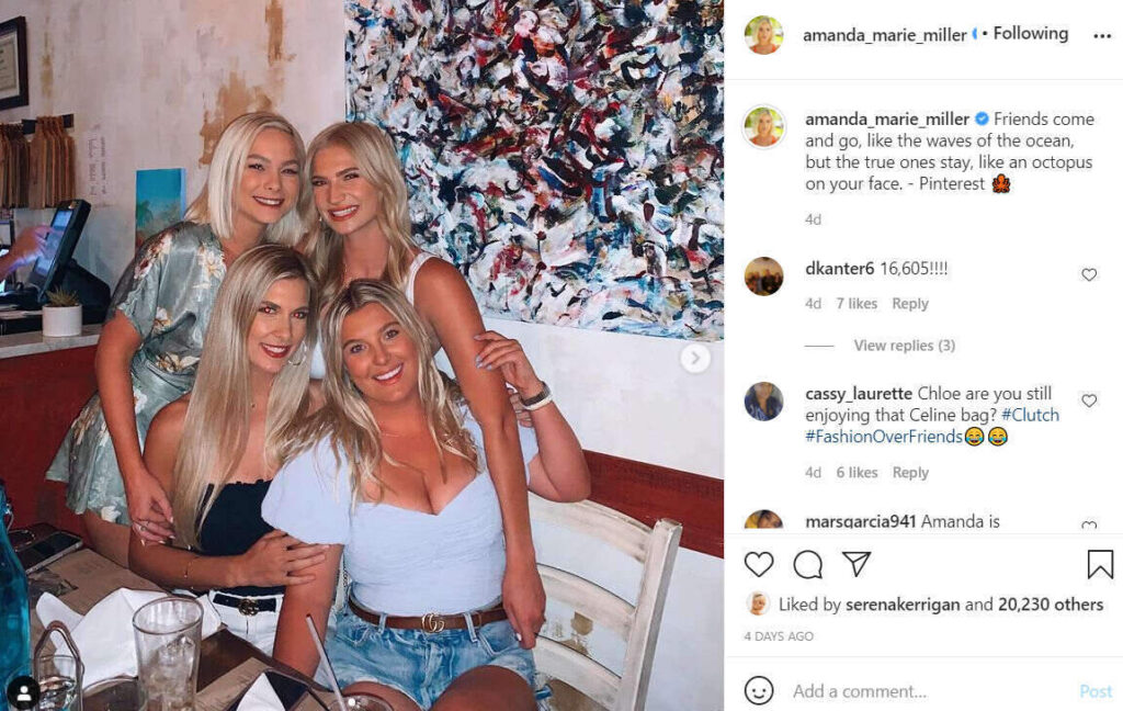 four female friends smiling at the camera