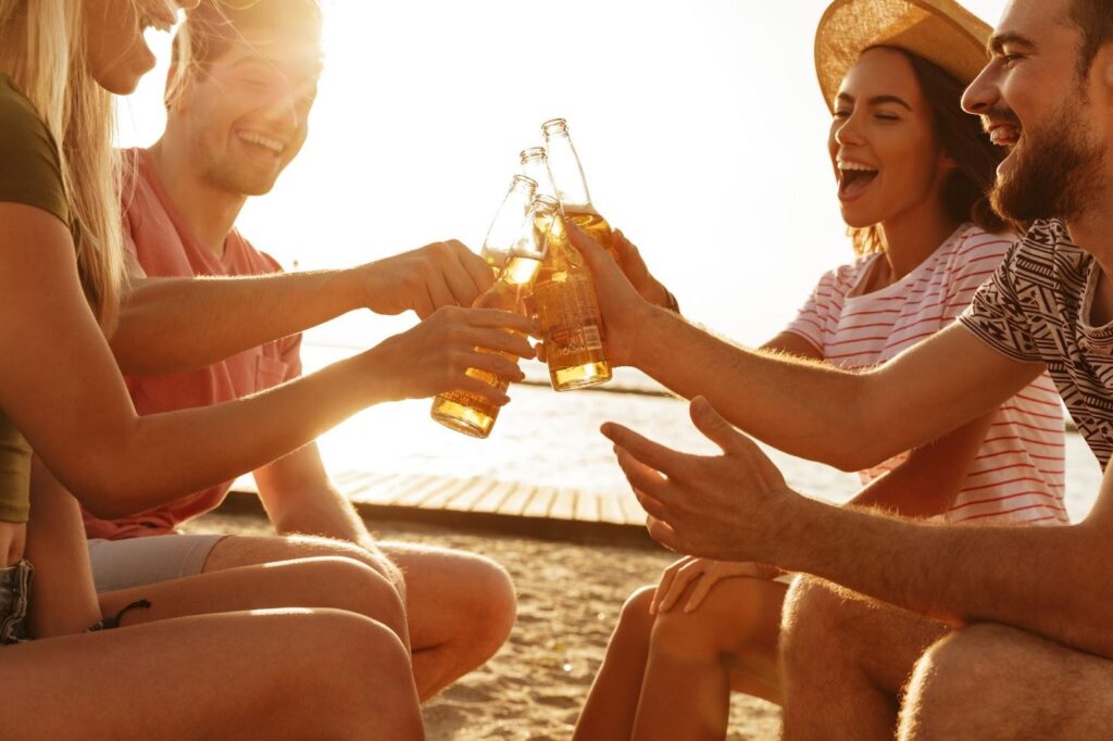 friends clinking beers together