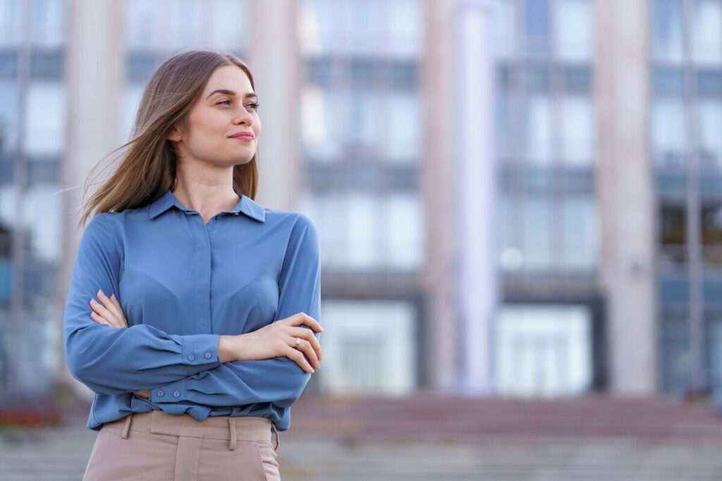 confident brunette smirking while posing for instagram