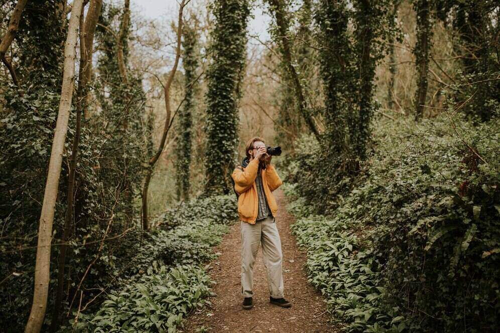 A man taking pictures in nature