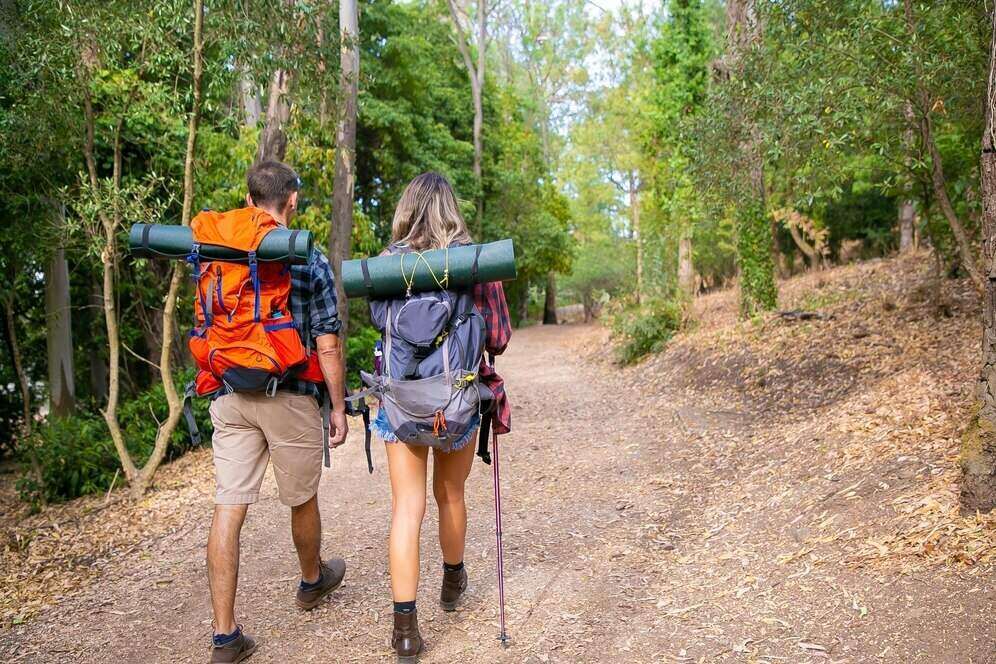 a couple hiking in the woods