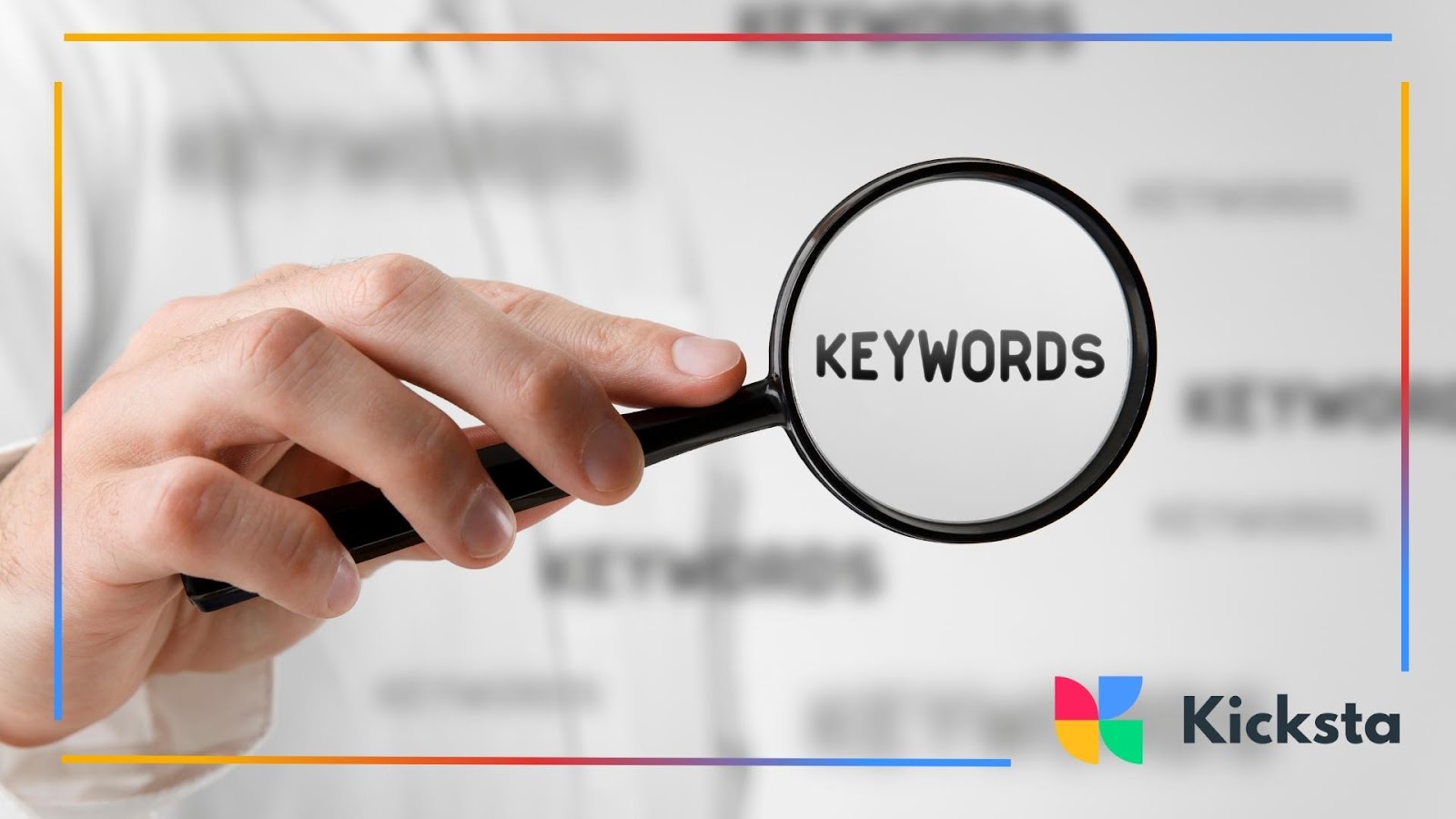 Hand holding magnifying glass highlighting the word keywords, symbolizing SEO strategy, search engine optimization, and digital marketing.
