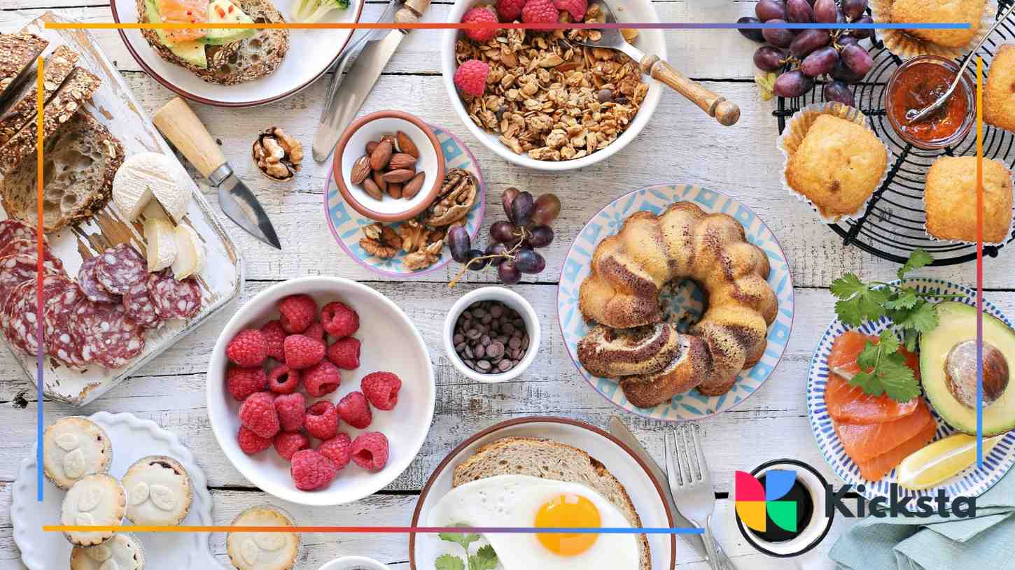 A vibrant brunch table filled with granola, berries, cold cuts, and pastries—perfect for a food influencer’s flat lay.