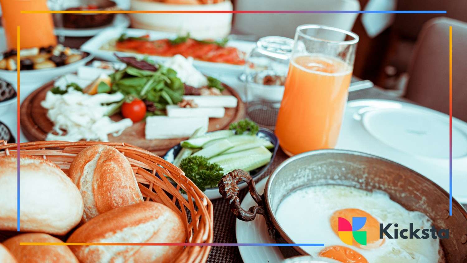 A close-up of a wholesome brunch setup featuring fresh bread, veggies, juice, and sunny-side-up eggs