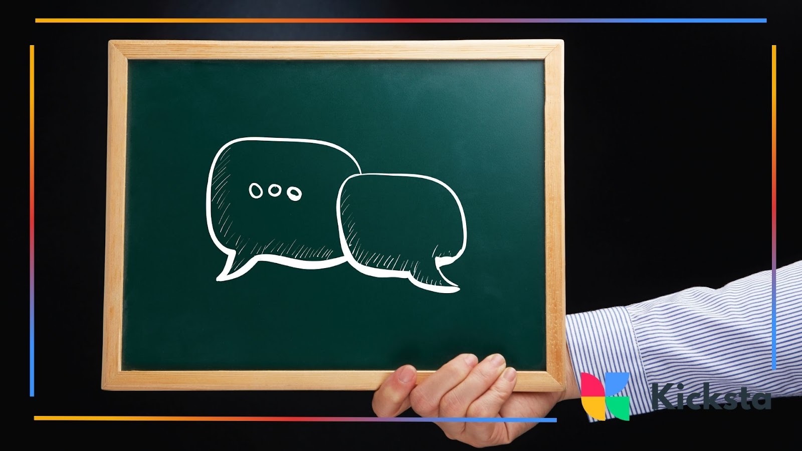 Hand holding chalkboard with illustrated speech bubbles, symbolizing communication, messaging, and social media conversation.