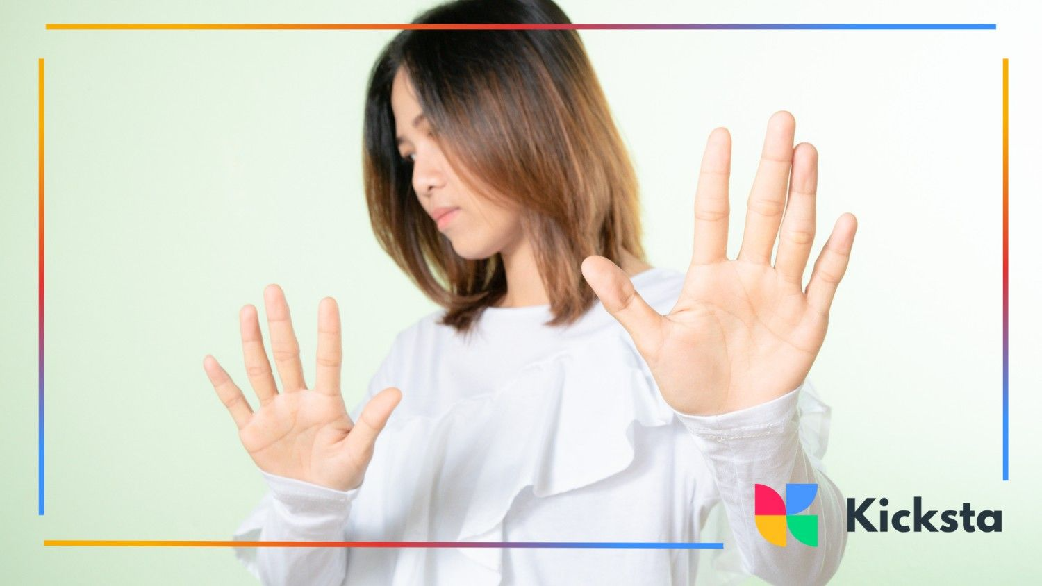 Girl with hands raised, signaling stop or rejection